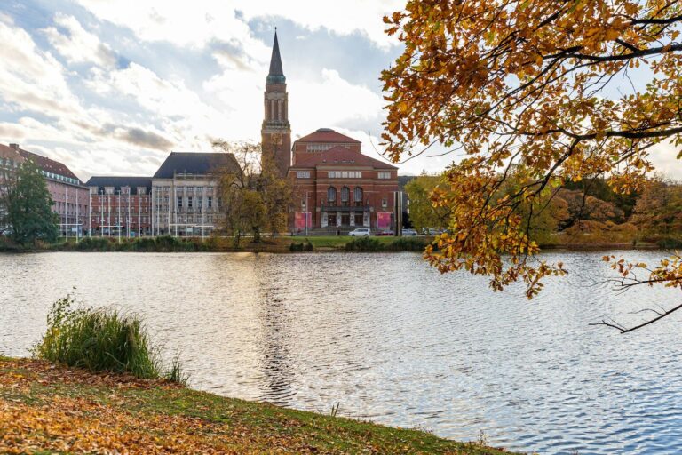 a view of a lake with a church in the background